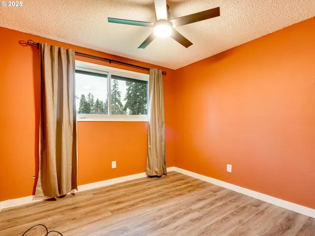 a bathroom with a granite countertop toilet sink and mirror