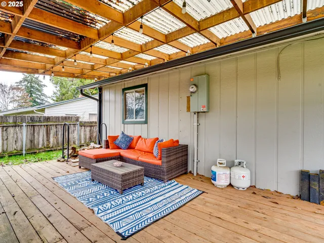 a wooden bench sitting in front of a building
