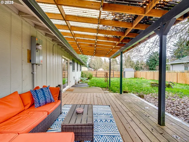 a house with a big yard and large trees