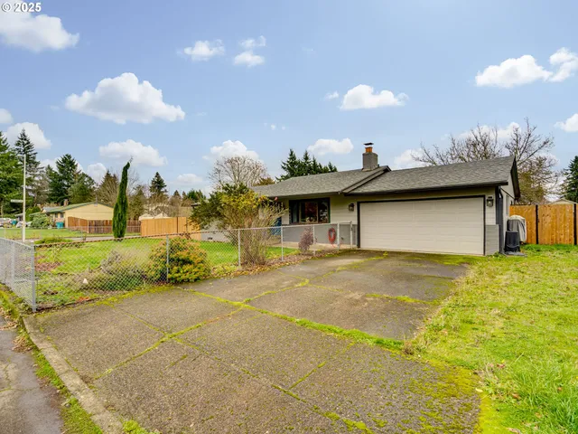a aerial view of a house with a yard