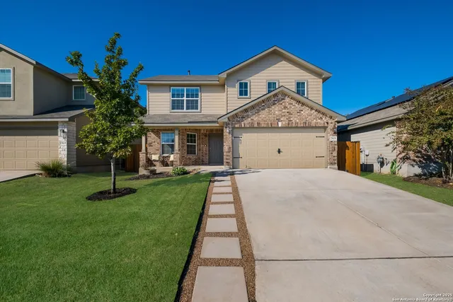 a bathroom with a sink toilet vanity and shower