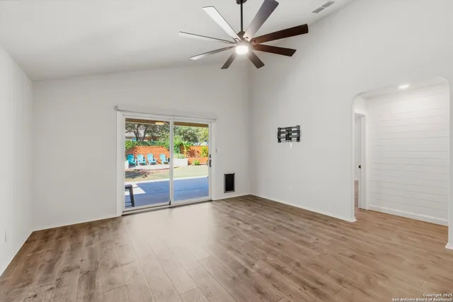 a view of a park with large trees