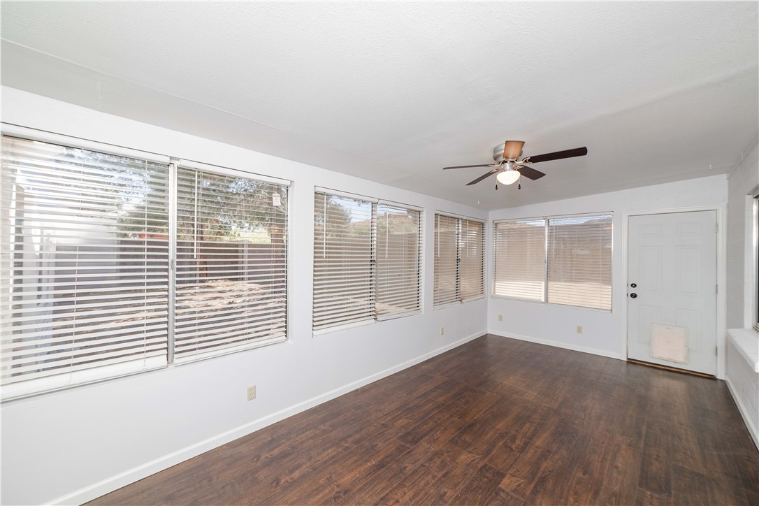 980 Canyon Hills Road Kingman, AZ 86409 - Photo 31 of 42 a view of empty room with wooden floor and fan