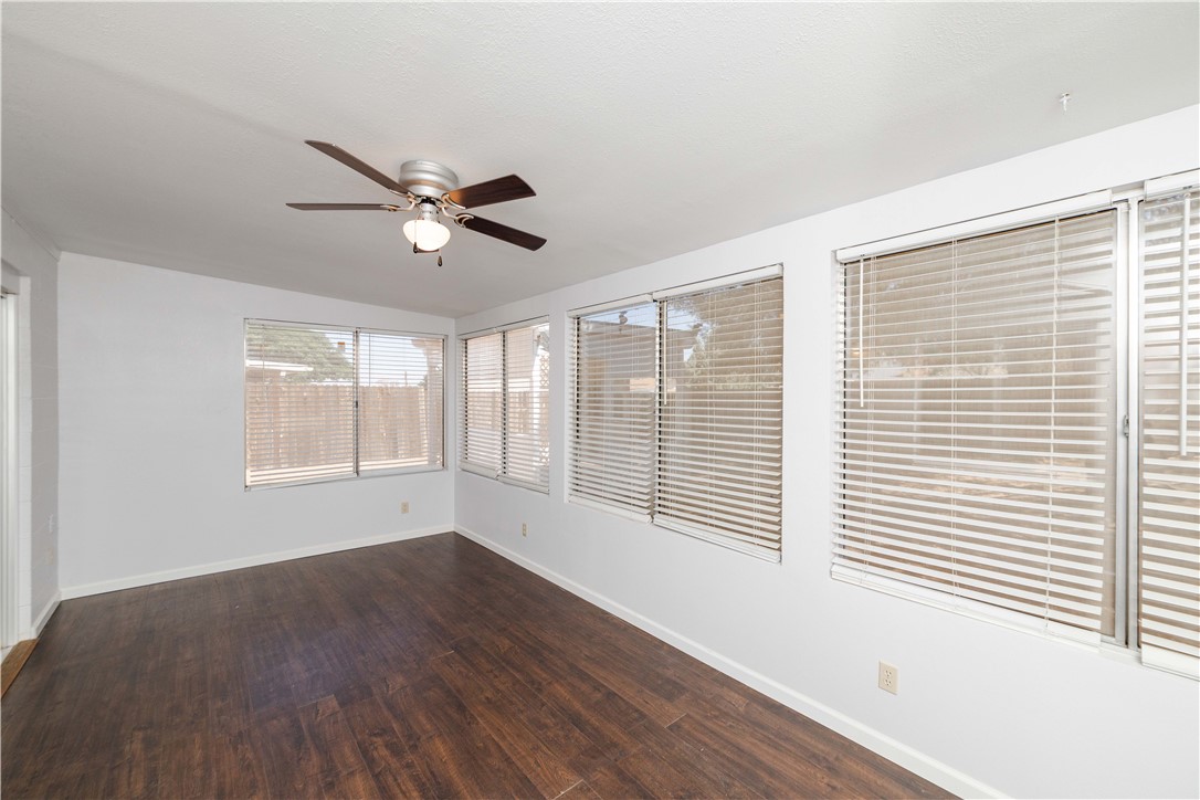980 Canyon Hills Road Kingman, AZ 86409 - Photo 33 of 42 a view of an empty room with a window and wooden floor