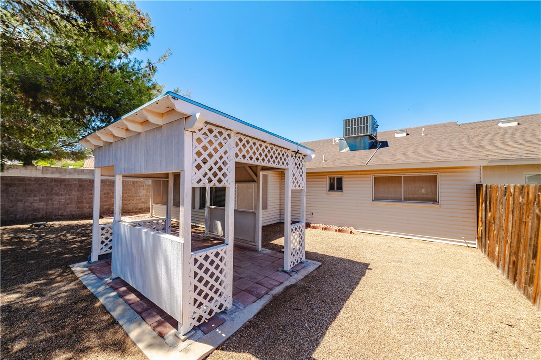 980 Canyon Hills Road Kingman, AZ 86409 - Photo 39 of 42 a front view of house with yard outdoor seating and barbeque oven