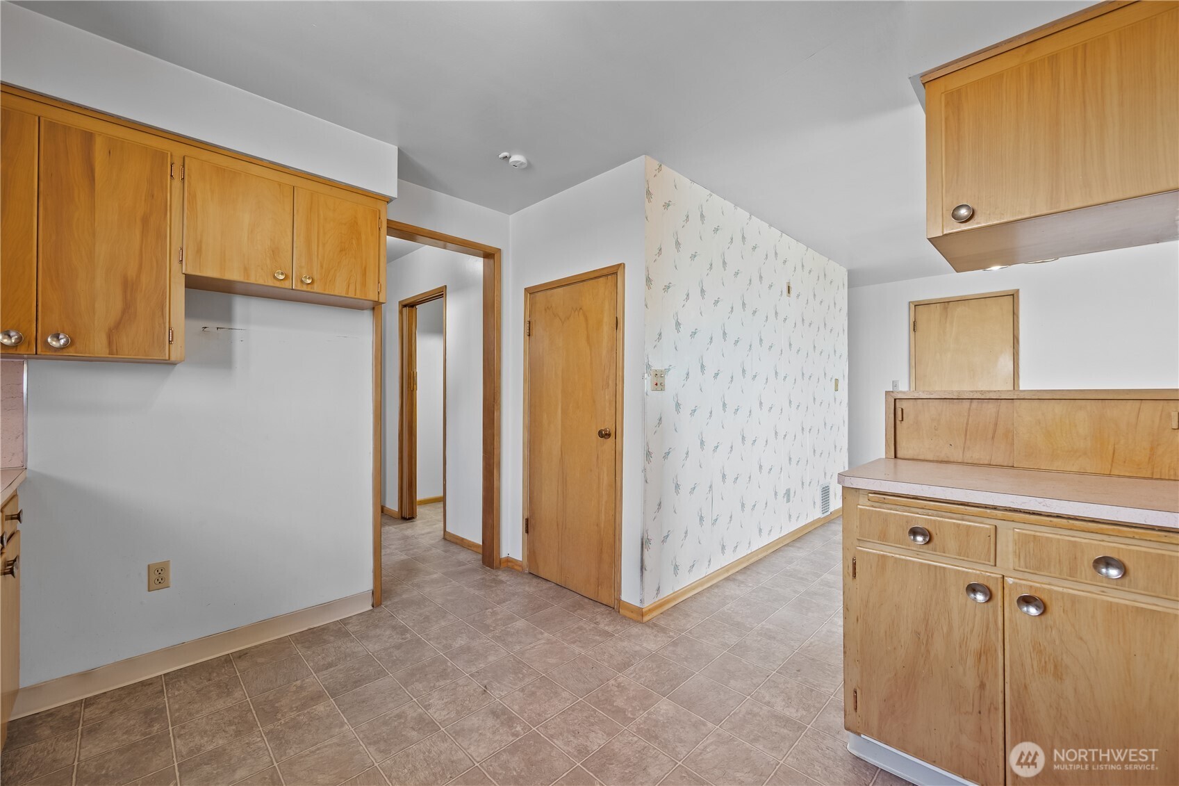1278 North Paha Packard Road Ritzville, WA 99169 - Photo 8 of 37 a view of a kitchen with fridge and wooden floor