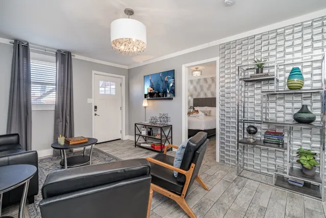 a room with fireplace furniture and a chandelier