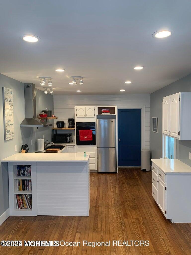 140 Franklin Avenue, Unit FRONT Ocean Grove, NJ 07756 - Photo 4 of 6 a living room with kitchen island and a wooden floor