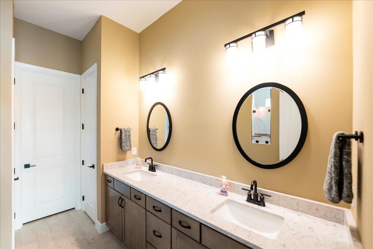 9941 Southwest Legacy Drive Stuart, FL 34997 - Photo 12 of 33 a bathroom with a sink and a mirror