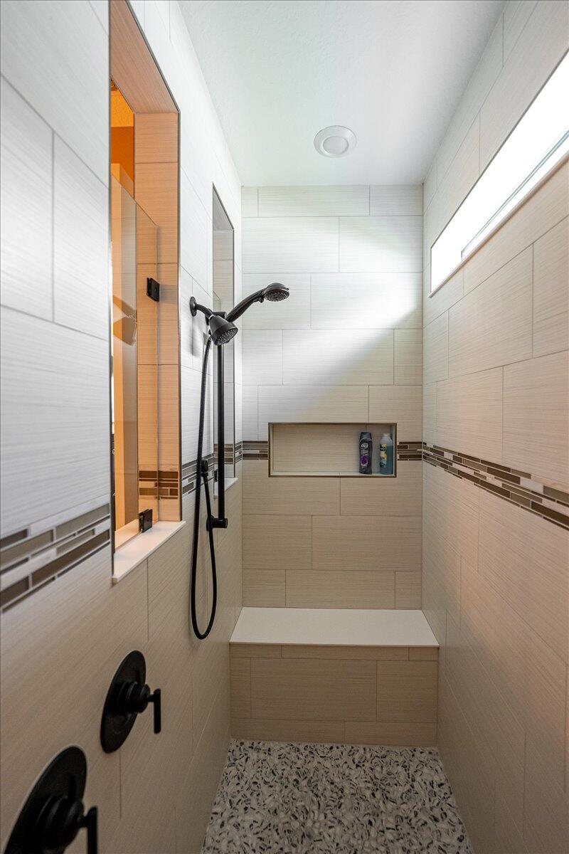 9941 Southwest Legacy Drive Stuart, FL 34997 - Photo 15 of 33 a bathroom with a shower