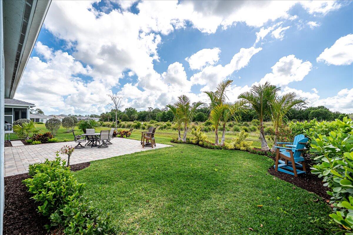 9941 Southwest Legacy Drive Stuart, FL 34997 - Photo 29 of 33 a view of a backyard with swimming pool
