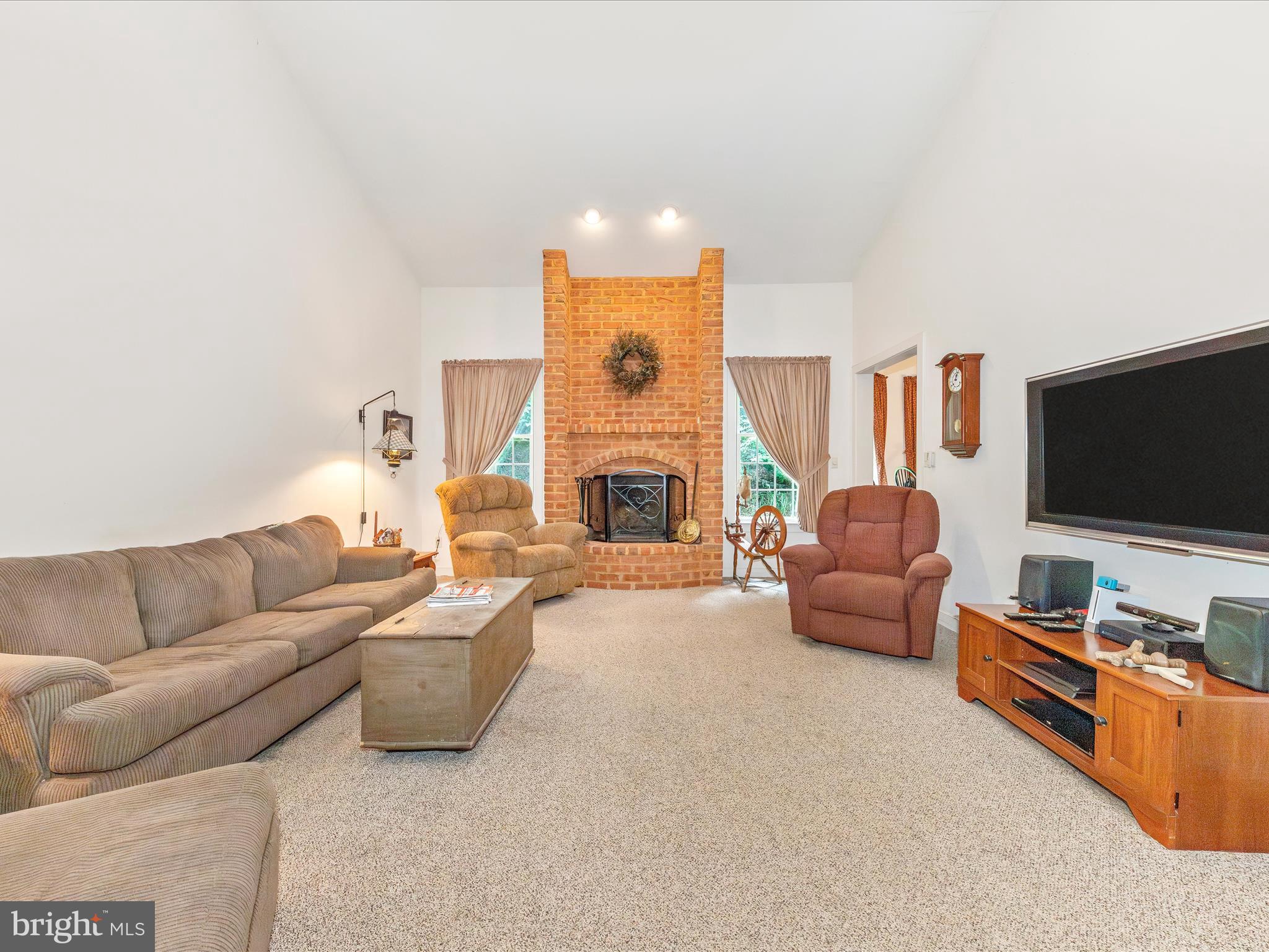 13013 Draper Road Clear Spring, MD 21722 - Photo 13 of 53 a living room with furniture and a flat screen tv
