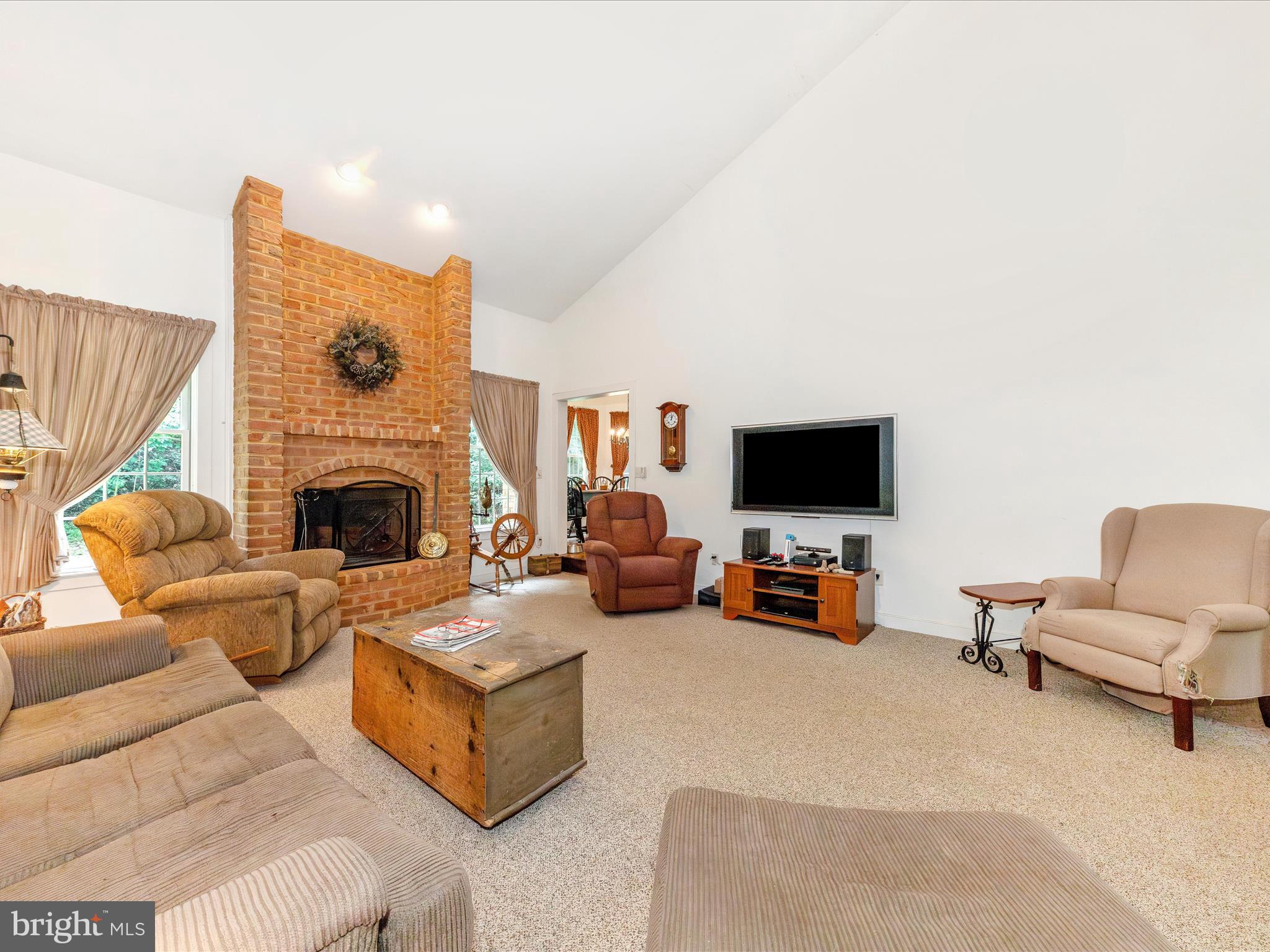 13013 Draper Road Clear Spring, MD 21722 - Photo 14 of 53 a living room with furniture and a fireplace
