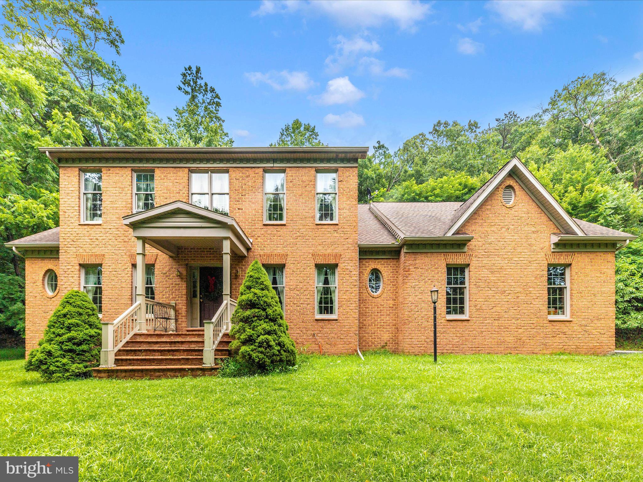13013 Draper Road Clear Spring, MD 21722 - Photo 2 of 53 a front view of a house with a yard