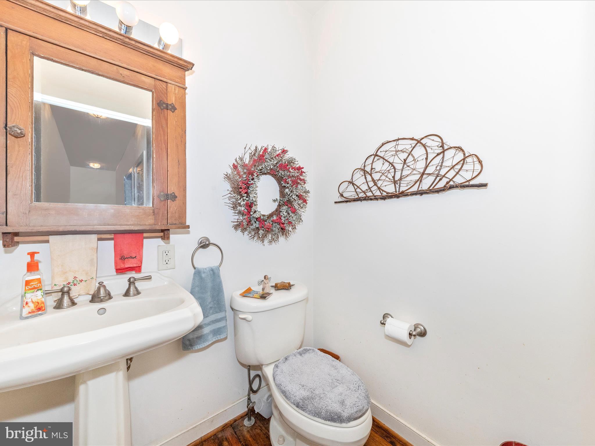 13013 Draper Road Clear Spring, MD 21722 - Photo 22 of 53 a bathroom with a toilet sink and mirror