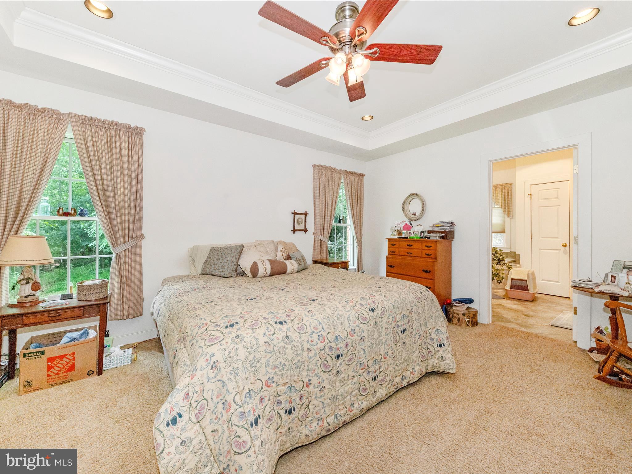 13013 Draper Road Clear Spring, MD 21722 - Photo 23 of 53 a bedroom with a bed and a chandelier