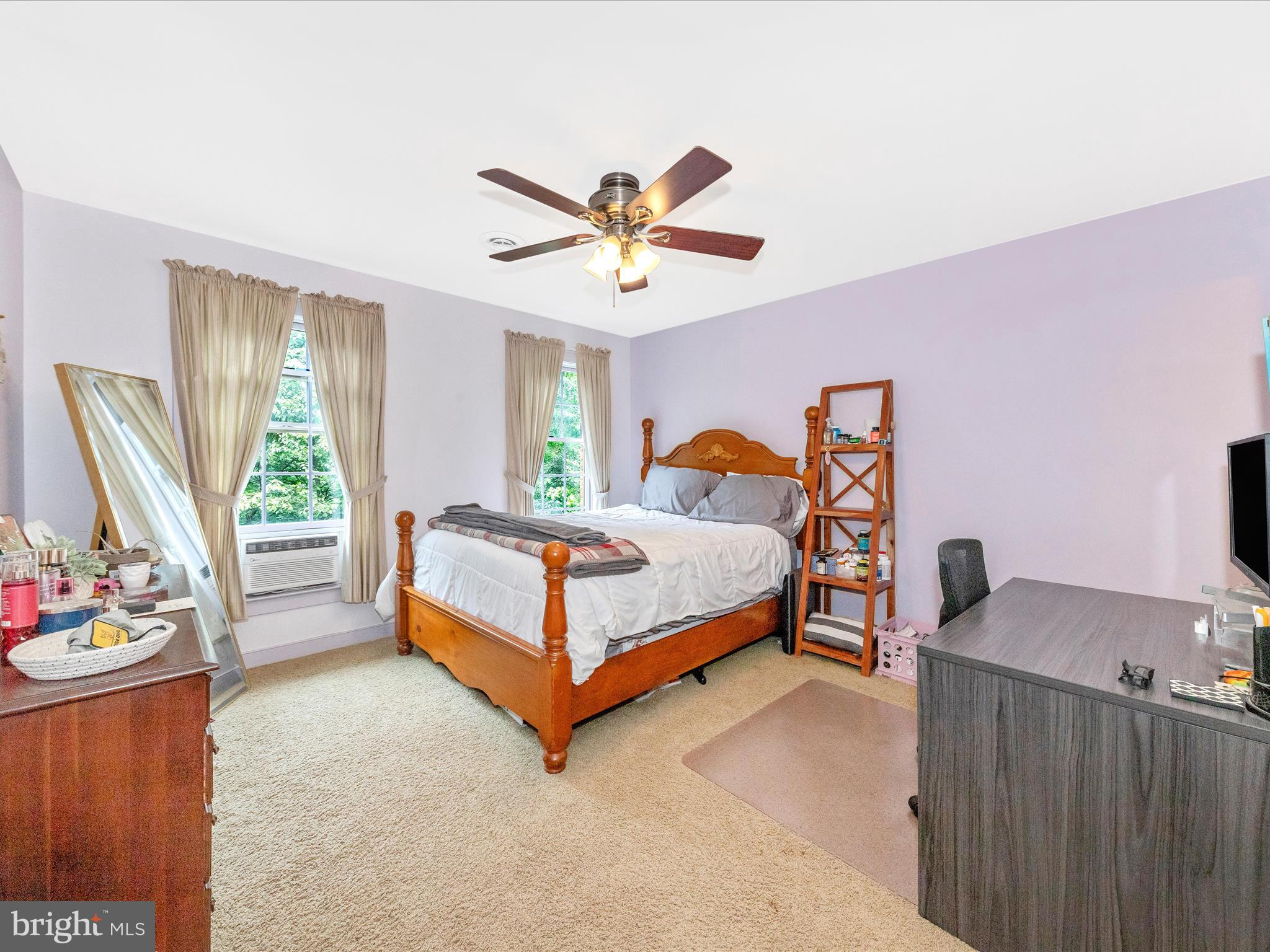 13013 Draper Road Clear Spring, MD 21722 - Photo 30 of 53 a bedroom with a bed and a chandelier