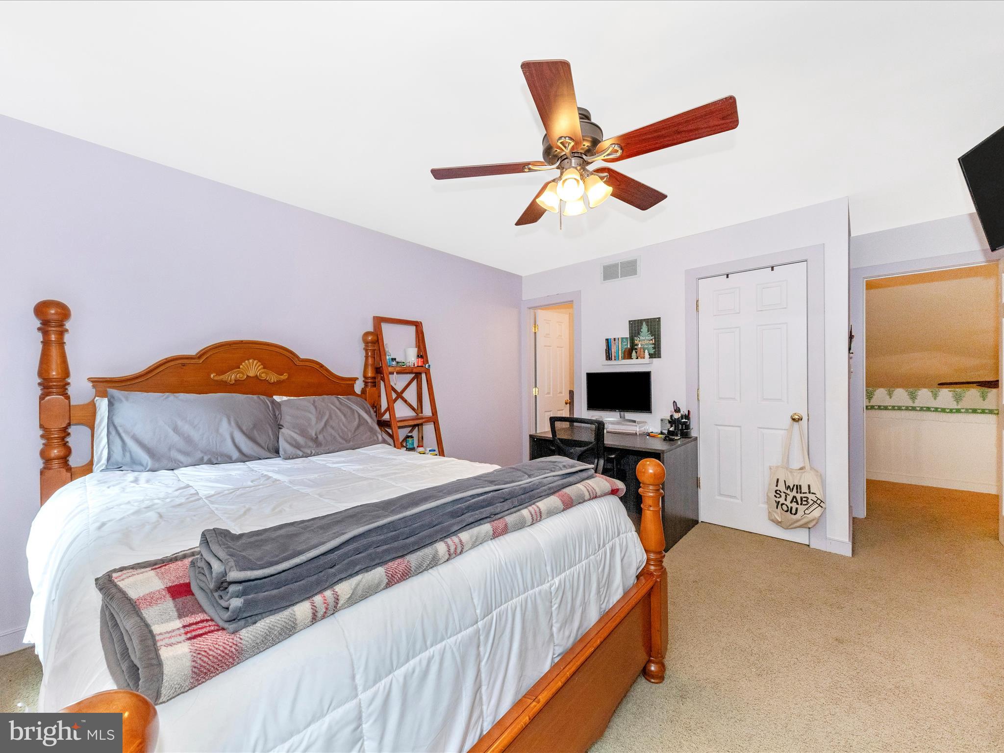 13013 Draper Road Clear Spring, MD 21722 - Photo 37 of 53 a bedroom with a bed and a chandelier