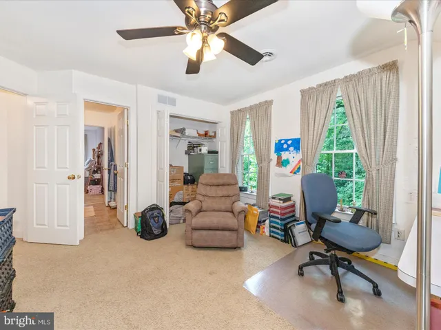 a bathroom with a sink mirror and vanity