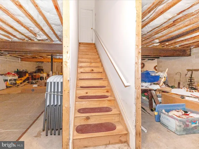 a view of a house with large windows and stairs