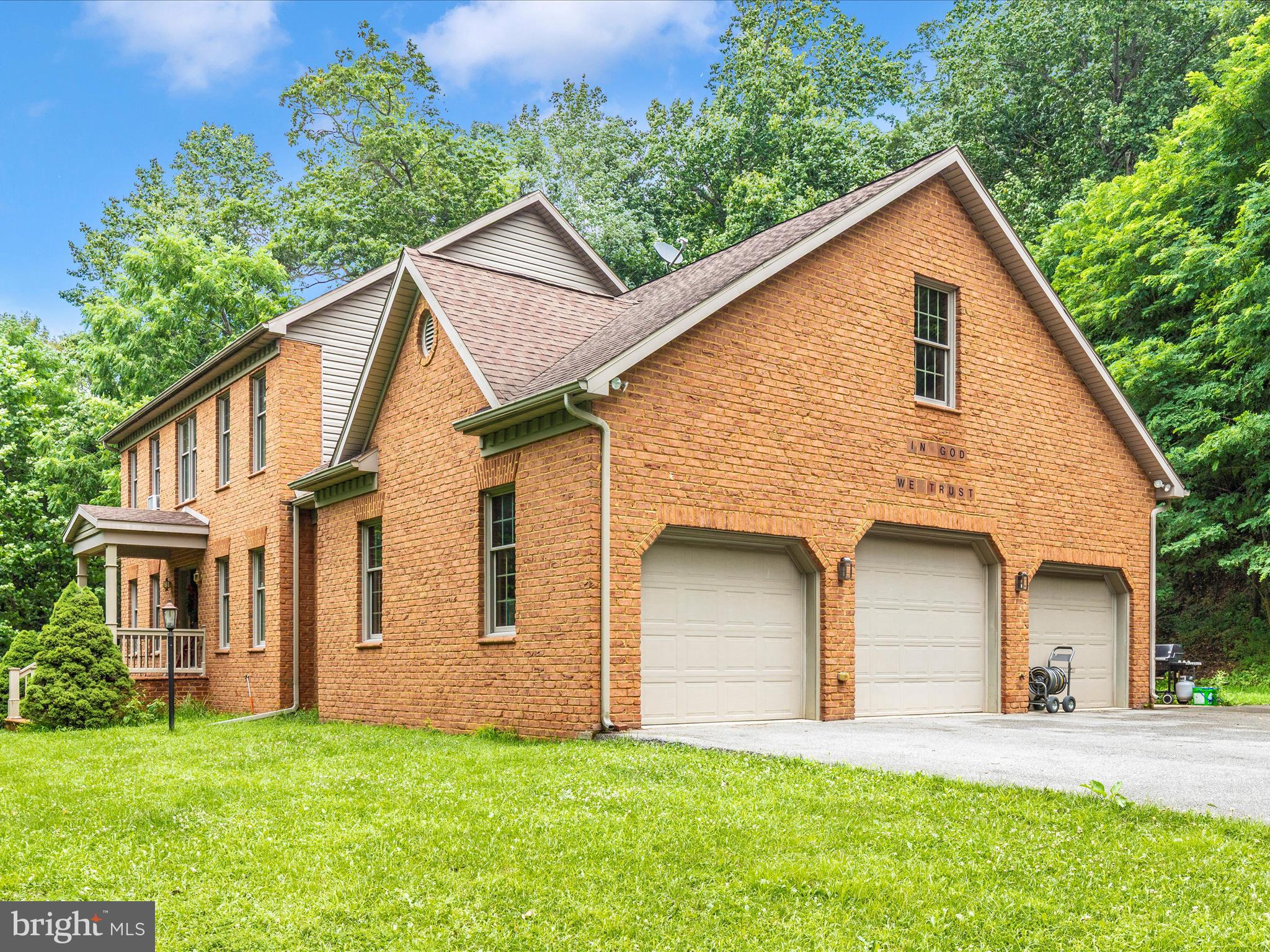 13013 Draper Road Clear Spring, MD 21722 - Photo 46 of 53 a view of a yard in front of a house with plants and large tree
