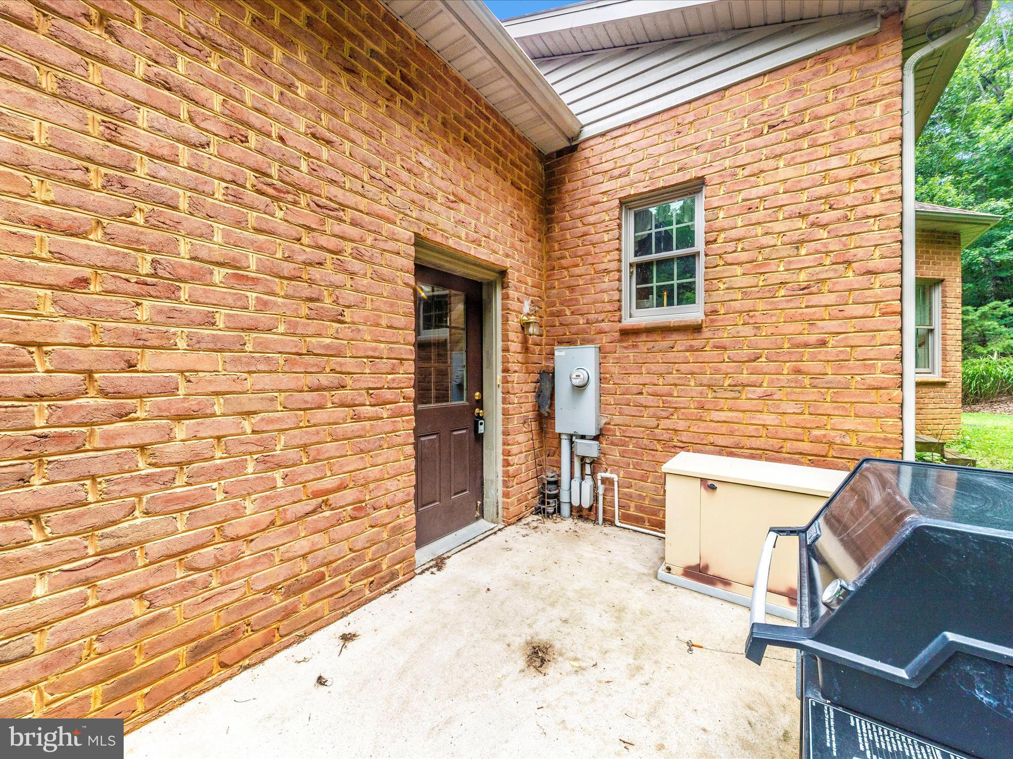 13013 Draper Road Clear Spring, MD 21722 - Photo 50 of 53 a view of a backyard with brick wall and furniture