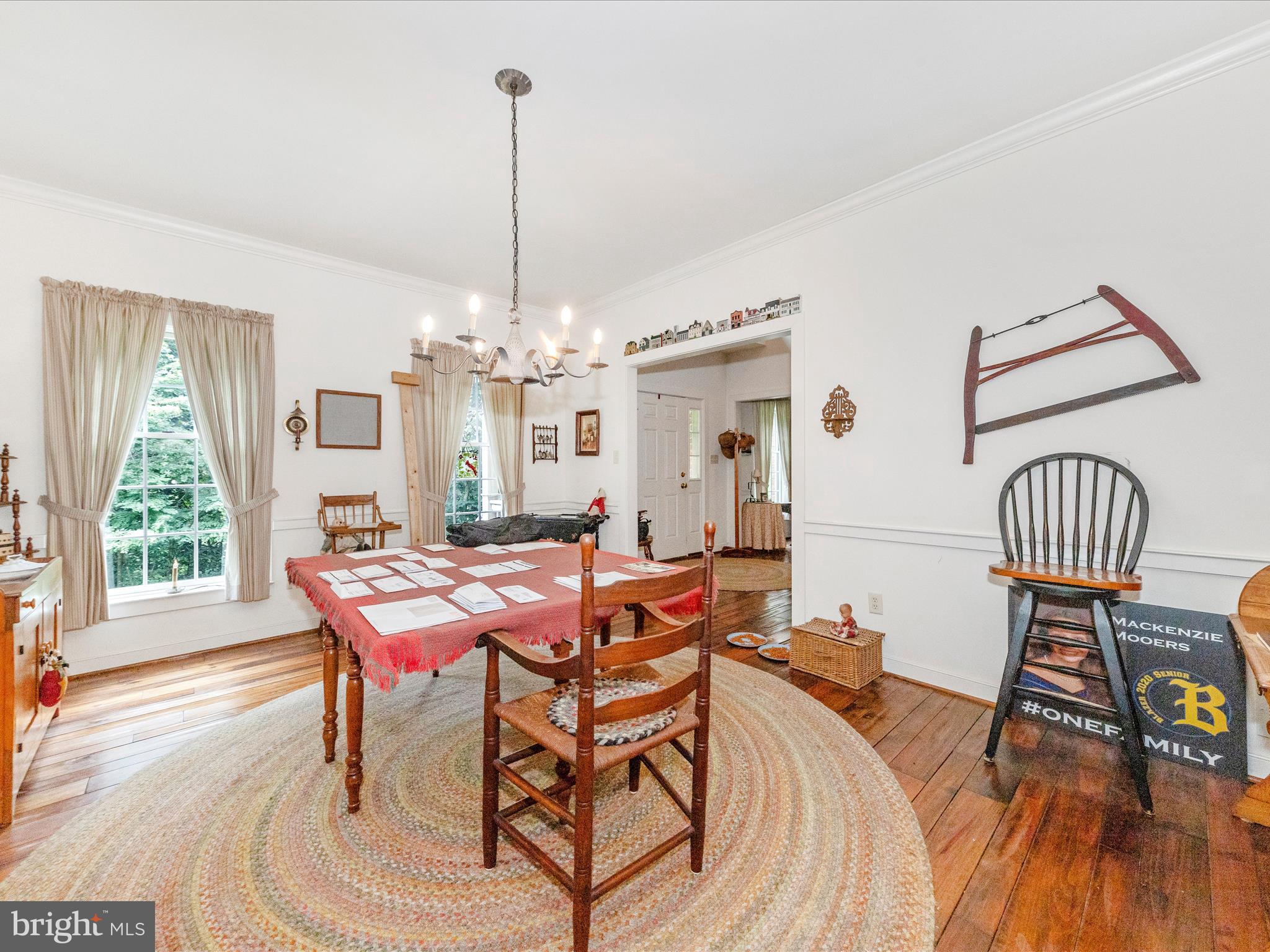 13013 Draper Road Clear Spring, MD 21722 - Photo 9 of 53 a dining room with furniture a chandelier and wooden floor