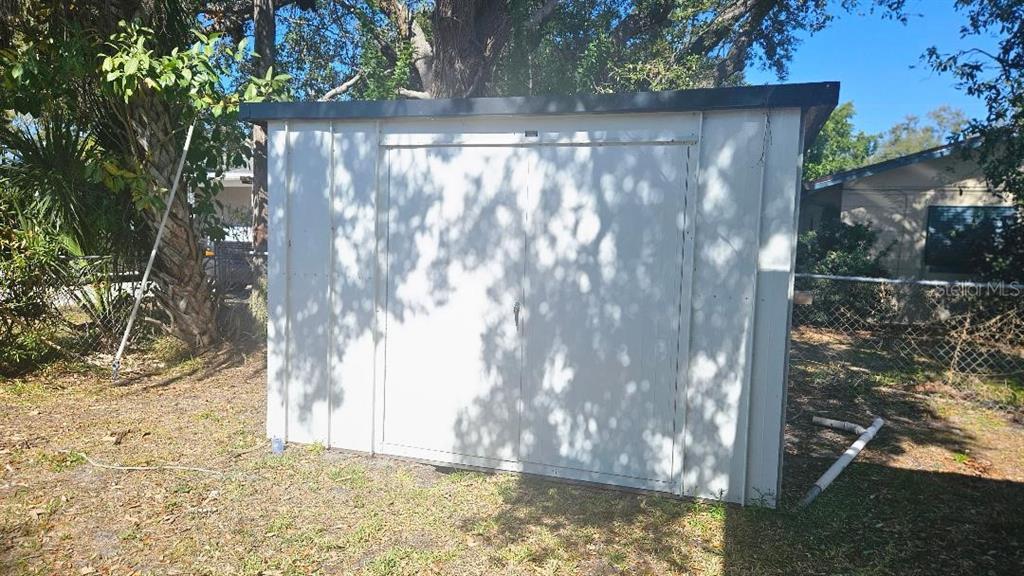 6542 Gem Lane Seminole, FL 33772 - Photo 18 of 19 a view of backyard with tree