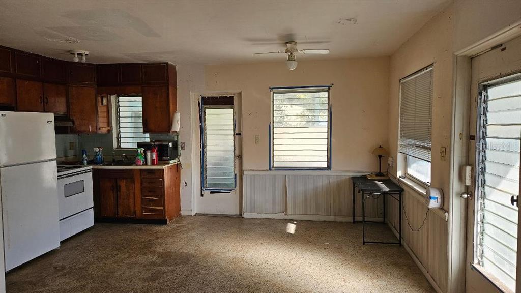 6542 Gem Lane Seminole, FL 33772 - Photo 3 of 19 a view of an empty room with a kitchen