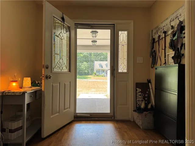 a bedroom with a bed furniture and a flat screen tv