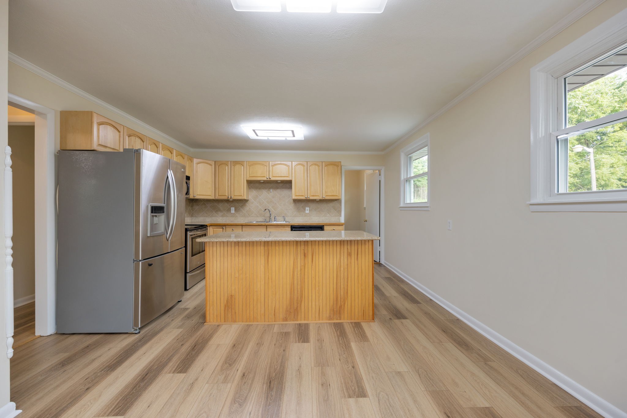 162 Searcy Road Mount Juliet, TN 37122 - Photo 16 of 46 a kitchen with stainless steel appliances granite countertop a refrigerator and a sink
