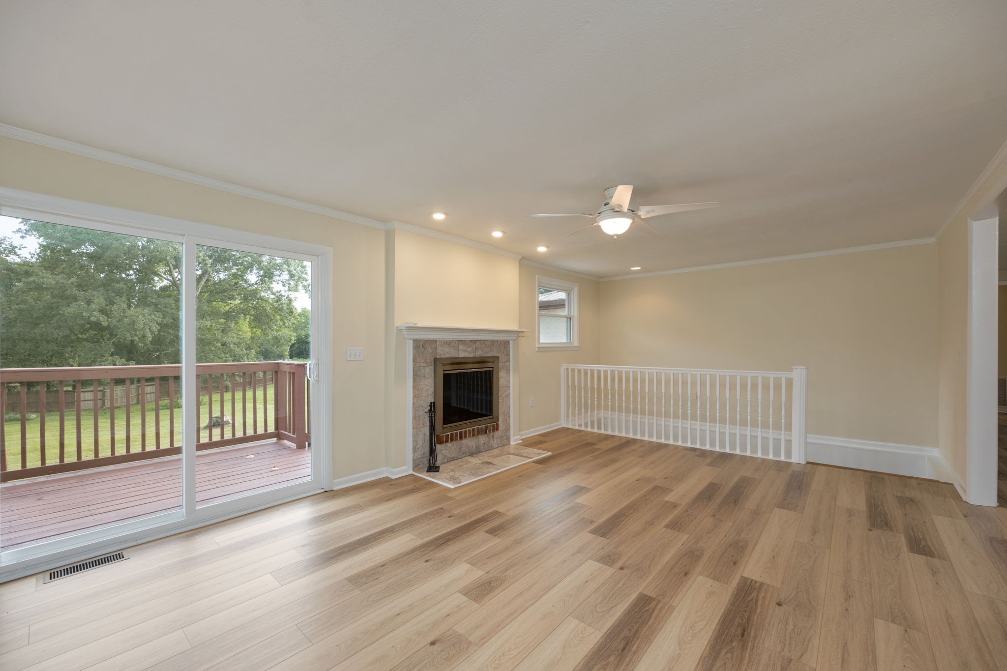 162 Searcy Road Mount Juliet, TN 37122 - Photo 20 of 46 wooden floor in an empty room with a fireplace