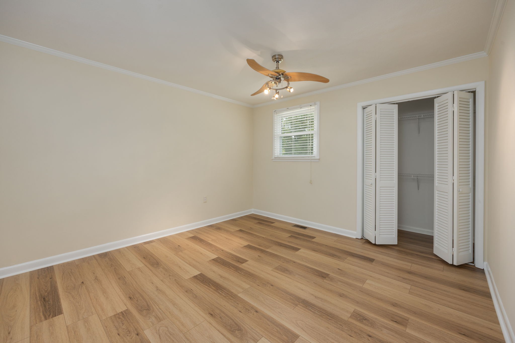 162 Searcy Road Mount Juliet, TN 37122 - Photo 30 of 46 an empty room with wooden floor ceiling fan and windows