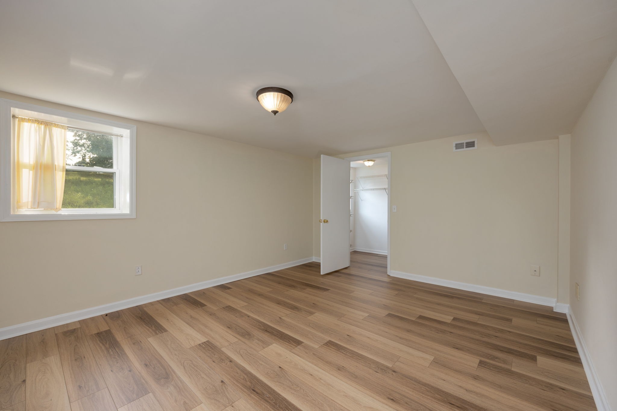 162 Searcy Road Mount Juliet, TN 37122 - Photo 33 of 46 a view of an empty room with wooden floor and a window