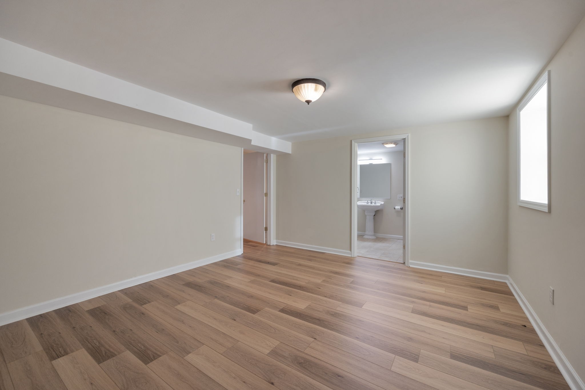 162 Searcy Road Mount Juliet, TN 37122 - Photo 35 of 46 a view of an empty room with wooden floor and a window