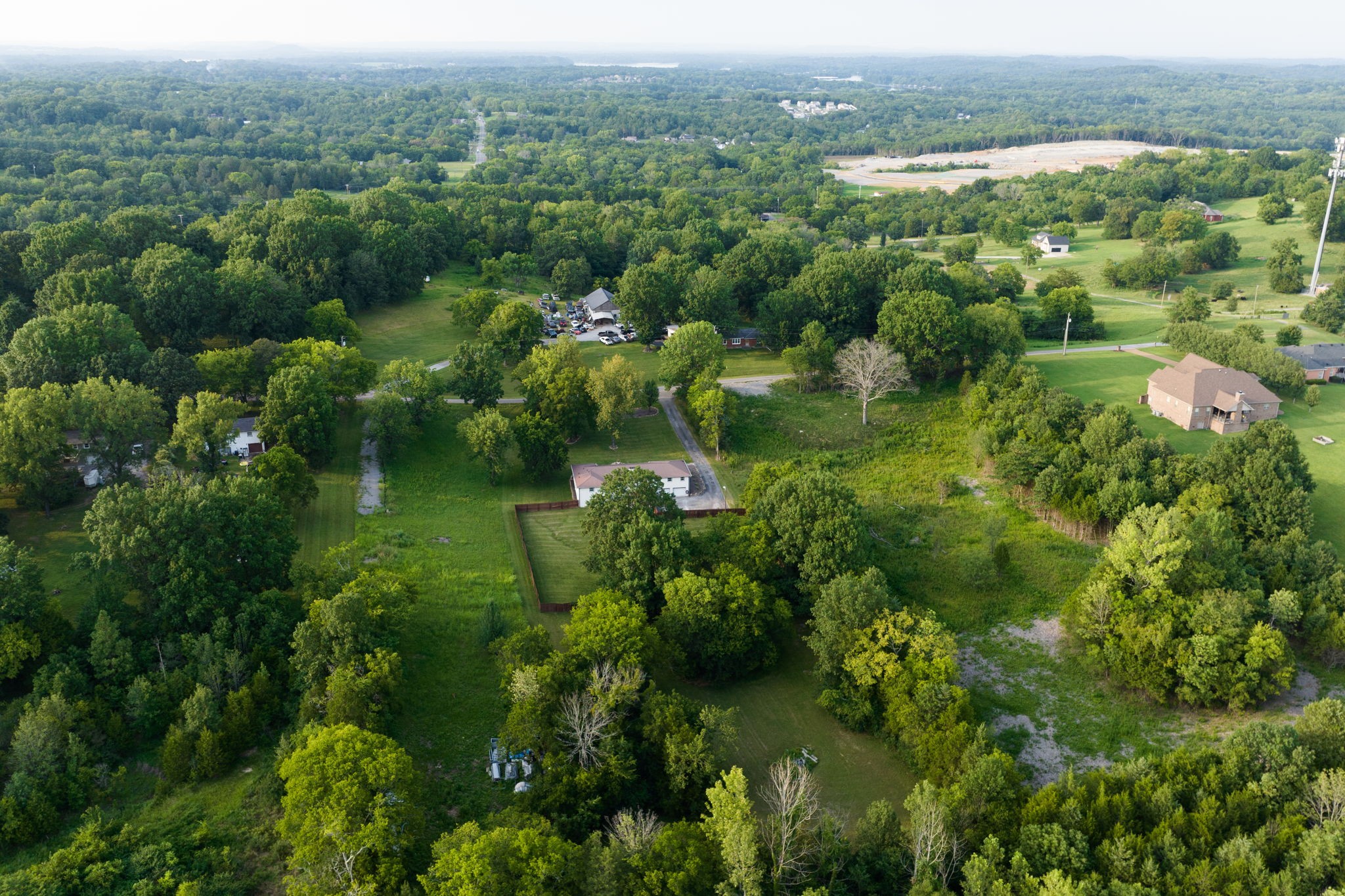 162 Searcy Road Mount Juliet, TN 37122 - Photo 42 of 46 an aerial view of a houses with a lush green hillside