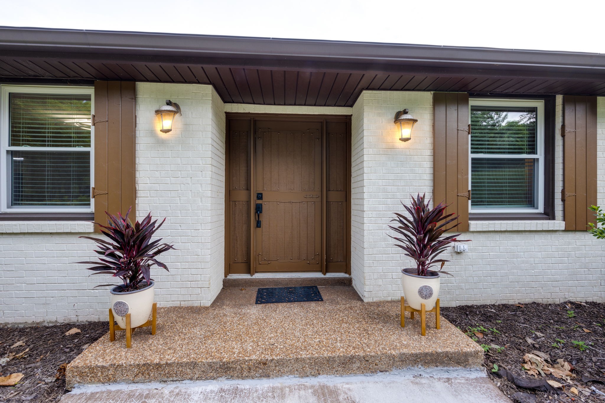 162 Searcy Road Mount Juliet, TN 37122 - Photo 6 of 46 a potted plant sitting in front of a door