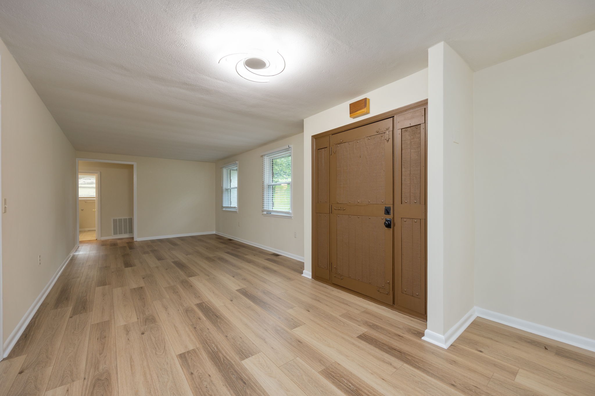 162 Searcy Road Mount Juliet, TN 37122 - Photo 9 of 46 an empty room with wooden floor and windows