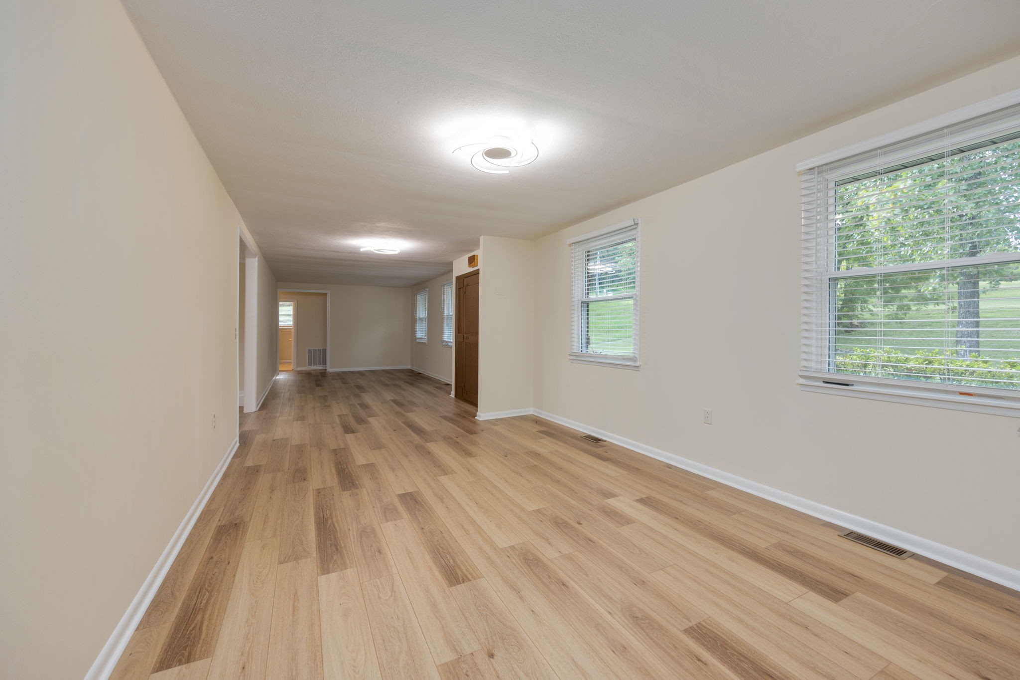 162 Searcy Road Mount Juliet, TN 37122 - Photo 10 of 46 a view of empty room with wooden floor and fan