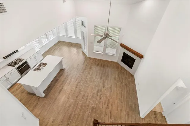 a view of a kitchen with wooden floor