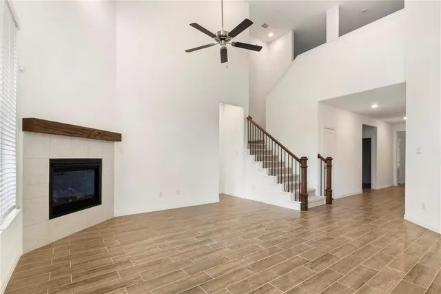 a view of an entryway and hallway with a fireplace
