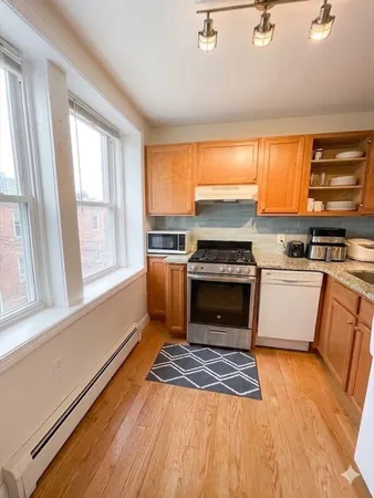 a kitchen with a stove a sink and a refrigerator