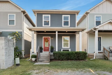 front view of a house with a yard