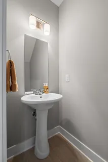 a bathroom with a sink and mirror
