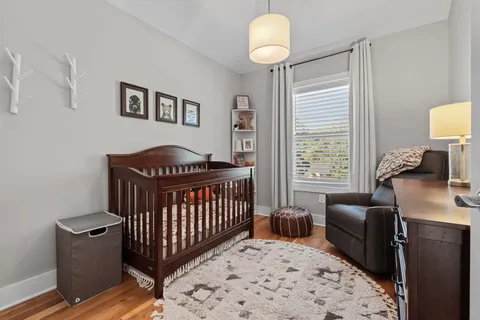 a bedroom with furniture and a window