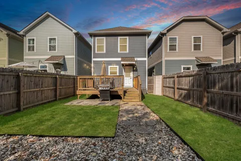 a view of a yard in front of a house with a yard