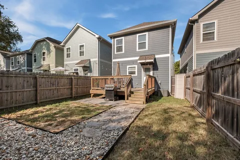 a view of a house with wooden roof and furniture