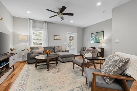 a living room with furniture and a window