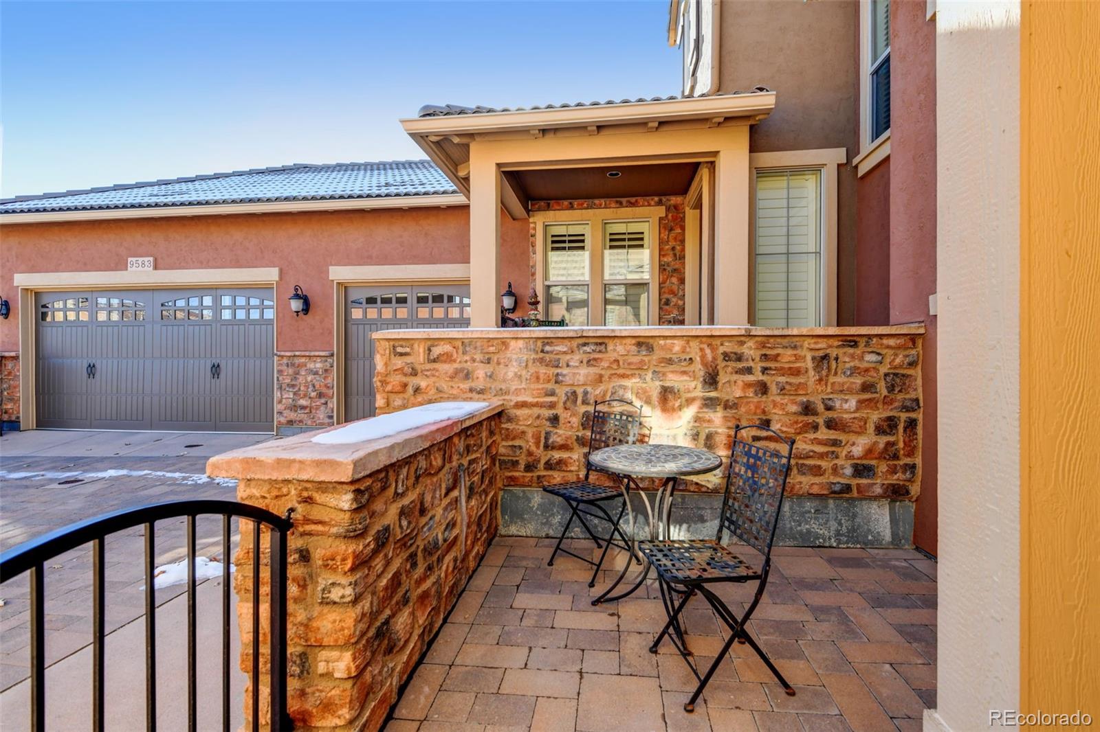 9581 Firenze Way Highlands Ranch, CO 80126 - Photo 36 of 48 a view of an chairs and table in the balcony