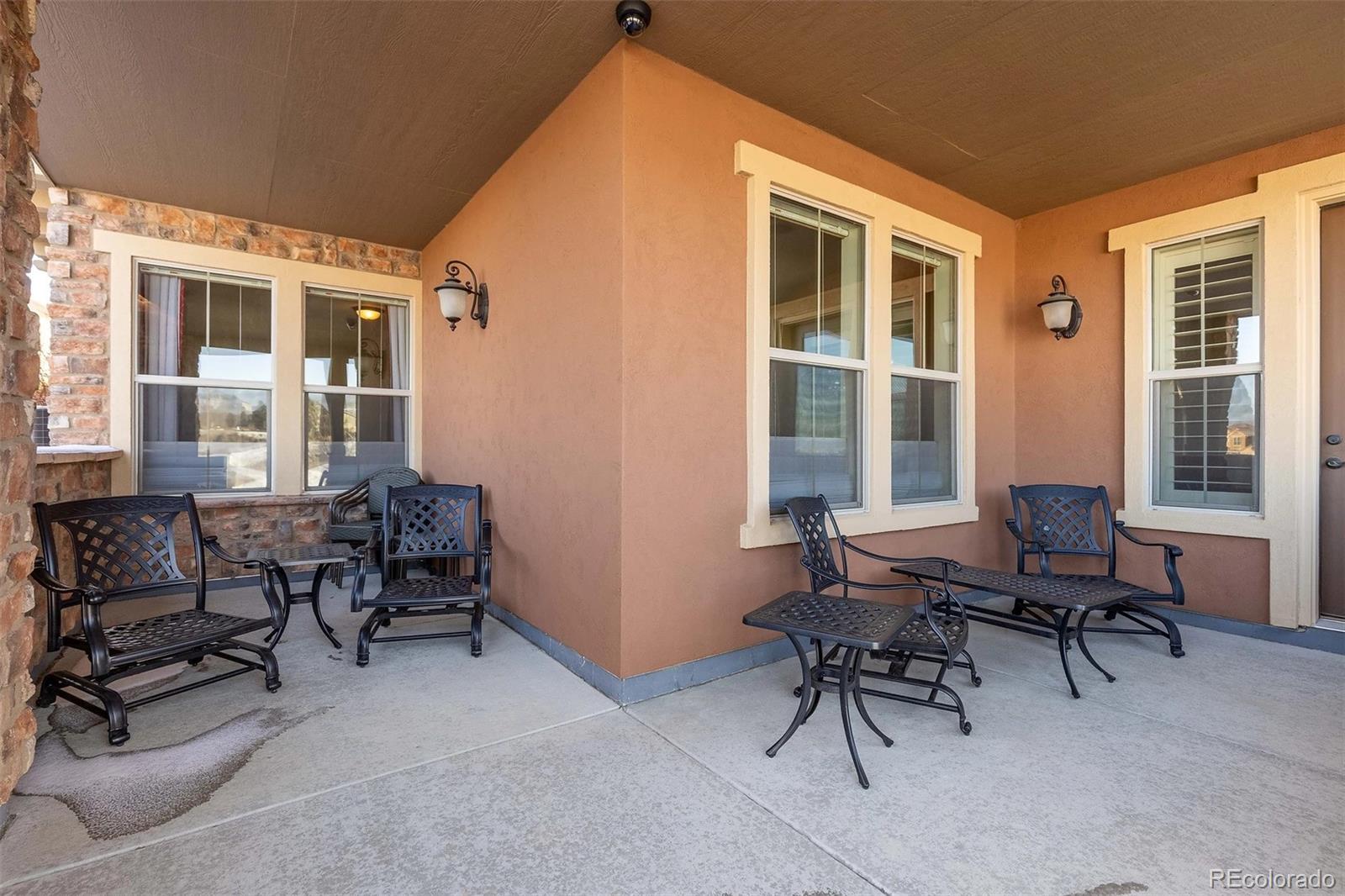9581 Firenze Way Highlands Ranch, CO 80126 - Photo 39 of 48 a living room with furniture and a window